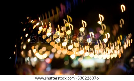 blurred abstract background christmas light with music note bokeh Royalty-Free Stock Photo #530226076