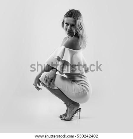 Pretty model woman posing in studio