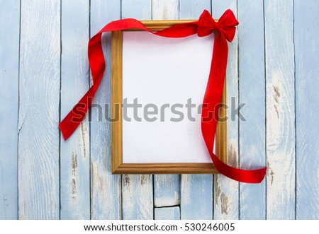 bow red ribbon photo frame blue white rusty vintage wooden background