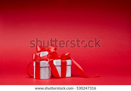 Red Christmas background with silver gifts