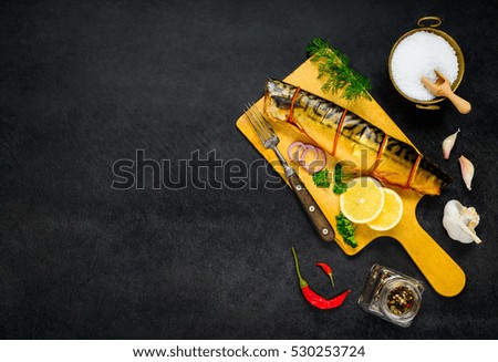 Smoked Mackerel Fish with Cooking Ingredients and Condiments