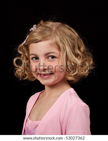 photo portrait of a young girl in a pink dress