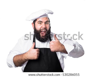 
Young bearded chef making an approval gesture isolated on white background