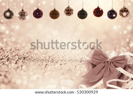 Christmas background with christmas ball and snow on glitter bokeh background