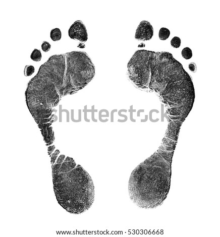Black prints of feet on transparent paper. Black footprint. Isolated on white. Royalty-Free Stock Photo #530306668