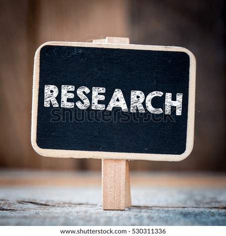 Research / Signboard with text research on blurred background
