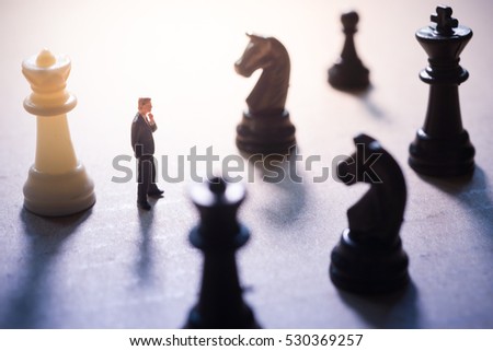 Concept of business strategy. Businessman with chess game. Royalty-Free Stock Photo #530369257