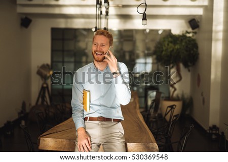 Handsome gingerbread businessman talking on the phone.