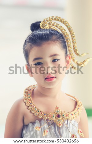 The dress of a young girl dressed in Thailand for dance performances.