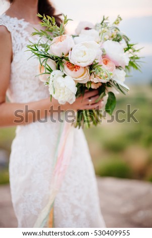 wedding bouquet orchids and peonies. Fine art wedding bouquet and flowers background