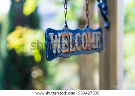 WELCOME sign on wooden board