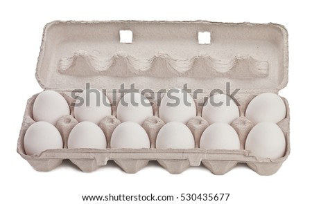 Dozen eggs in cardboard container isolated on white Royalty-Free Stock Photo #530435677