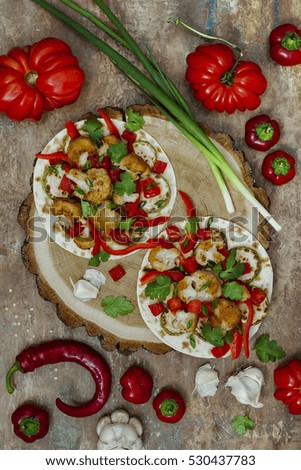Spicy veggies tacos with roasted cauliflower,  zucchini and tomato salsa on rustic wooden cutting board. Preparing healthy lunch vegetarian snack. Top view, overhead, flat lay
