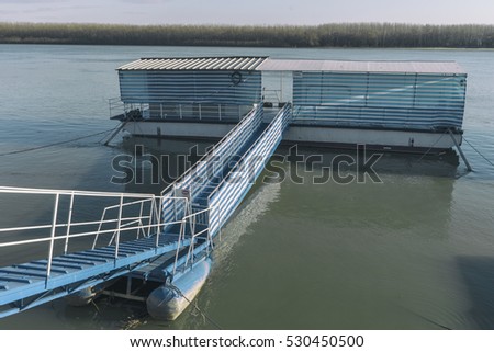 Blue and white dock/Great colors design on this pontoon on the river Danube on a sunny early winter day.