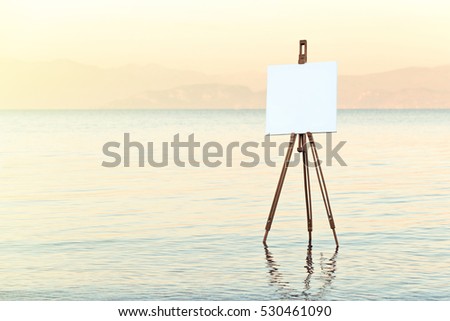 easel with white canvas in the water