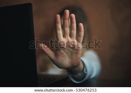Teen girl excessively sitting at the computer laptop at home. he is a victim of online bullying Stalker social networks Royalty-Free Stock Photo #530476213