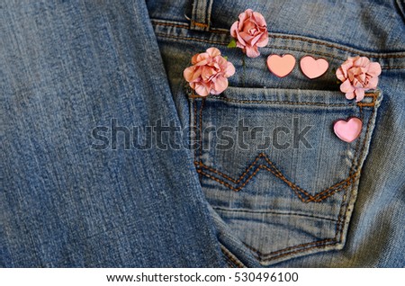 on jeans background laid roses and hearts. Backgrounds Valentine's Day. Wedding background. love card. pocket jeans