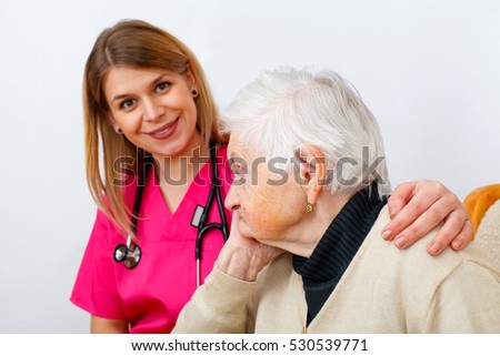 Picture of a disabled senior woman with her caregiver