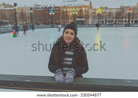 beautiful girl at the rink on a winter's day, alone.