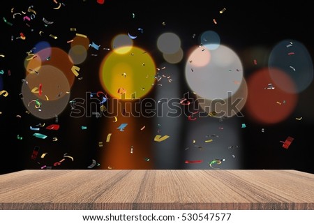 Empty wood table and ribbon motion multicolored  night light bokeh for Christmas  New Year background. with copy space  add text