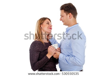 Picture of a happy young couple posing on an isolated background