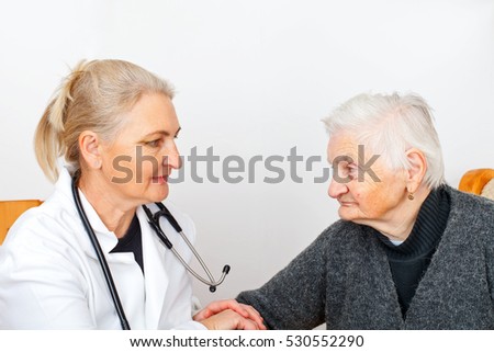 Picture of an old lady with her caregiver
