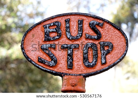 Vintage Savannah, Georgia orange and black enamel bus stop sign. Horizontal.