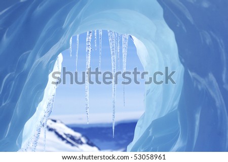 Icicles hanging from an iceberg on Antarctica Royalty-Free Stock Photo #53058961
