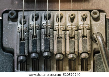 Detail of electric guitar pickups with dust, Close up shot of dirty Electric guitar tremolo



