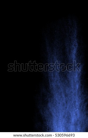 Splash of colorful powder on black background