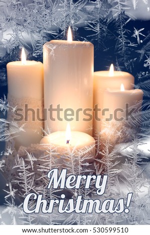 Candles light. Christmas candles burning at night. Golden light of candle flame. Abstract ice pattern. Inscription "Merry Christmas" Royalty-Free Stock Photo #530599510