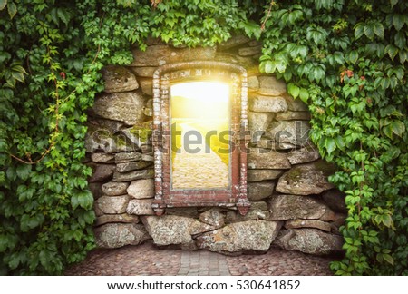 Grunge old stone wall with window in sunny world. Hope concept