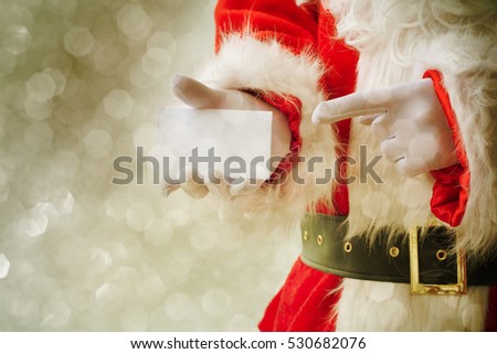 Santa Claus holding visit card