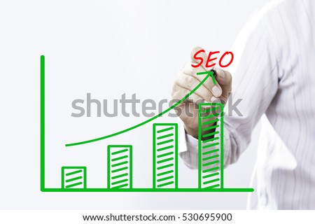 "SEO" text with hand of young businessman point on virtual graph green line and bar showing on increasing with background -business, finance, salary, crisis, and development concept