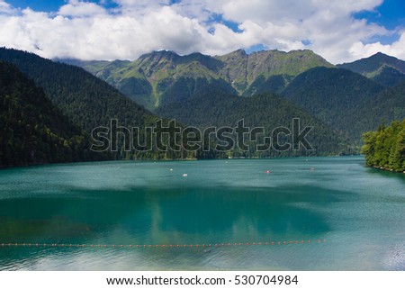 View to famous highland lake Ritsa and mountains. Lake Ritsa is symbol of Abkhazia