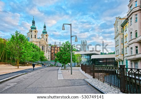 St Mary Magdalene Church and Promenade, Karlovy Vary, Czech republic. People on the background. Royalty-Free Stock Photo #530749141