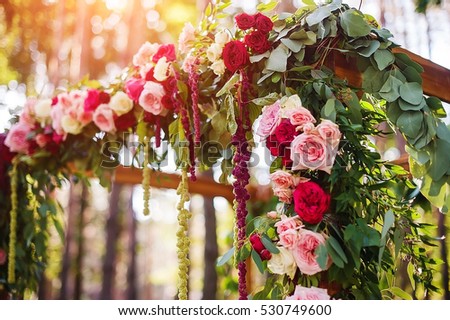 wedding arch and  decoration in green forest. picture with soft focus