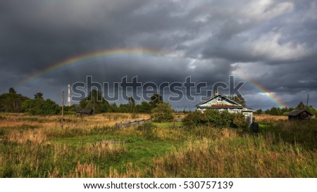 Rainbow in the village. Russia.