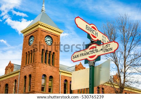 Cityscape view of Birch Avenue and San Francisco street signs with clock tower in Flagstaff, Arizona. Royalty-Free Stock Photo #530765239