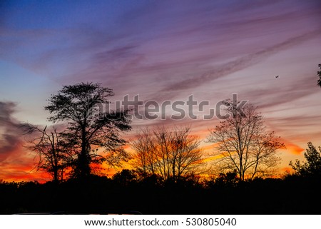 Bright colorful sunset on the sea with beautiful clouds Autumn sunset pink sky