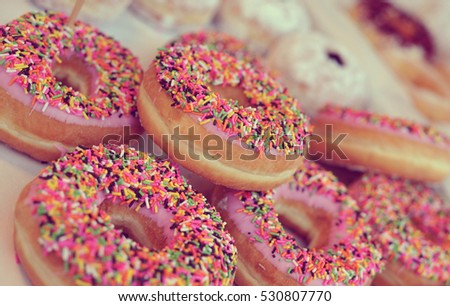 Homemade colorful donuts with chocolate and icing glaze, sweet icing sugar food