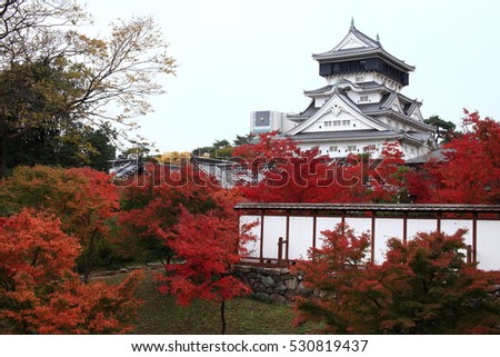Kokura-jo Castle, Japanese Castle in Katsuyama Public Park,Filled with red leaves In the fall leaves.Onsen atmosphere. Royalty-Free Stock Photo #530819437