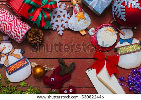 Christmas background with decorations on wooden background. Top view with copy space