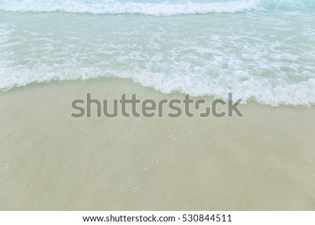 Soft wave of blue ocean on sandy beach. Background, Pattaya Thailand