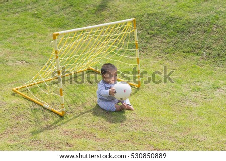 Fat Boy were playing football on the lawn.The goalkeeper position is a fat boy.