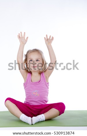 child yoga gymnastics on a mat