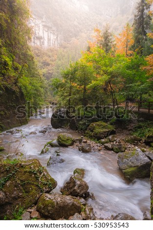 Beautiful view of waterfall landscape. Small waterfall in deep green forest 