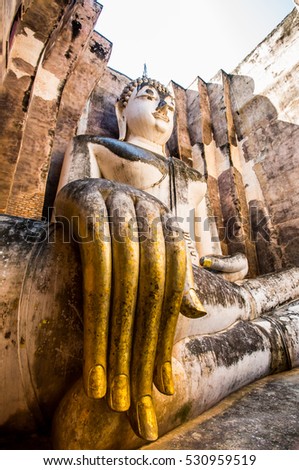 ancient remains of world heritage sukhothai historical park Thai,statue in religion Thailand  ,  are public  domain  ,no restrict in copy or use . This photo  taken   these  conditions