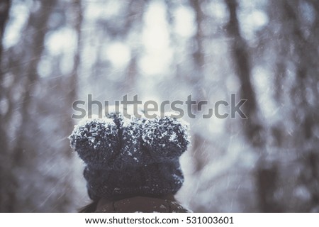 woman walking in forest. winter and people concept. vintage toned picture with filter
