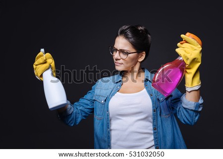 Doubtful cleaning woman making a decision